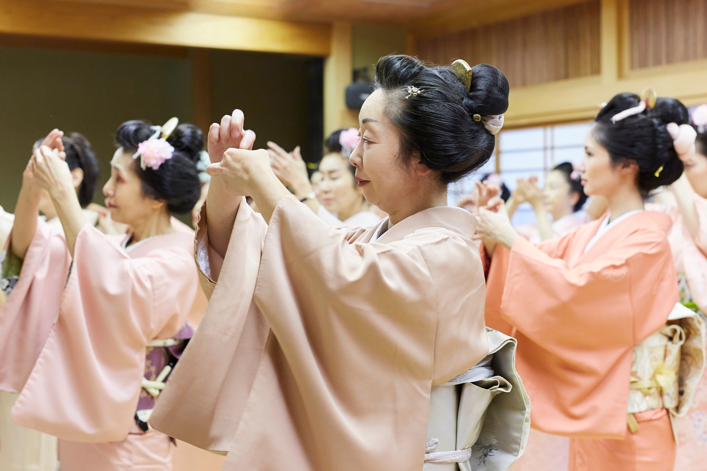 Female dancers rehearsing Bon Festival dance, wearing kimonos